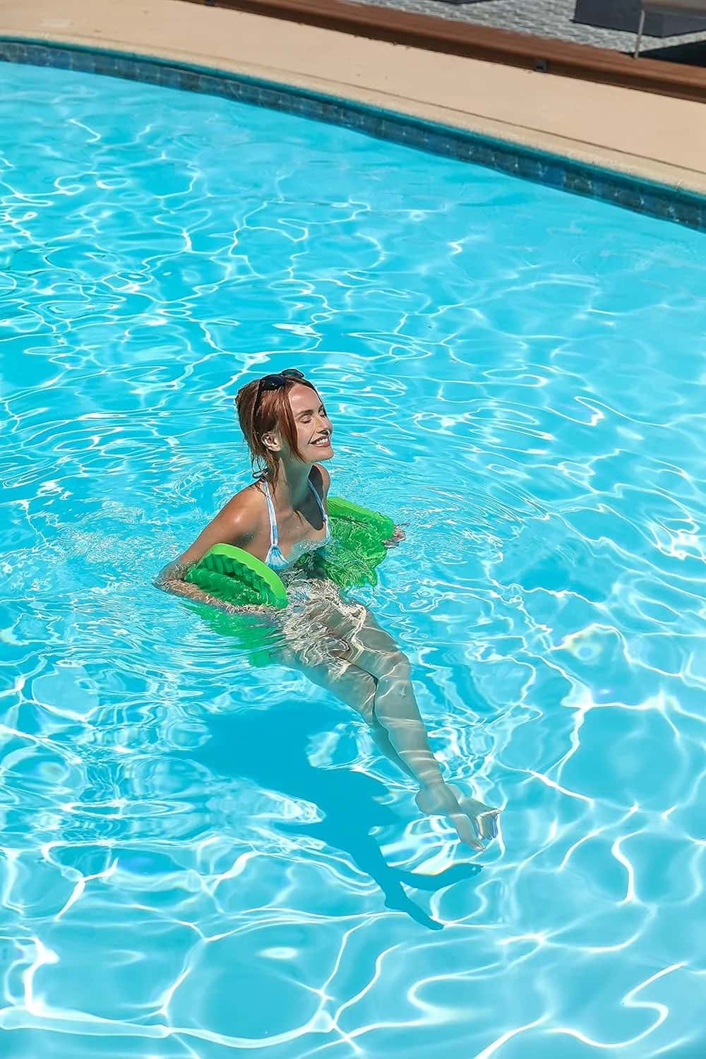Woman smiling on a Cococabana green saddle float
